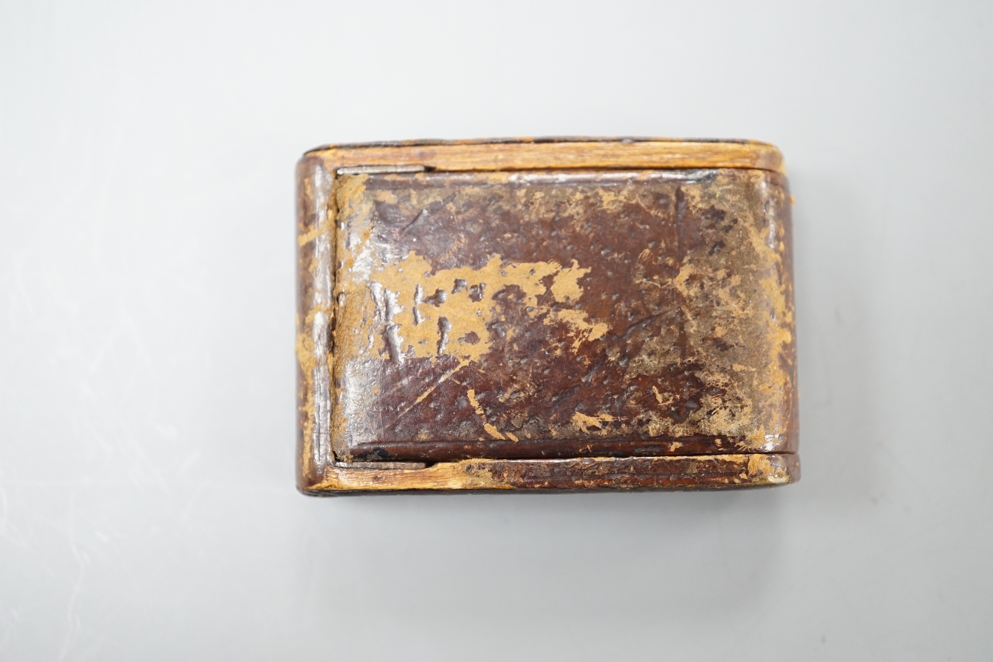A mid 20th century leather case mounted stainless steel LeCoultre for Cartier travelling watch, with Arabic dial, 5cm.